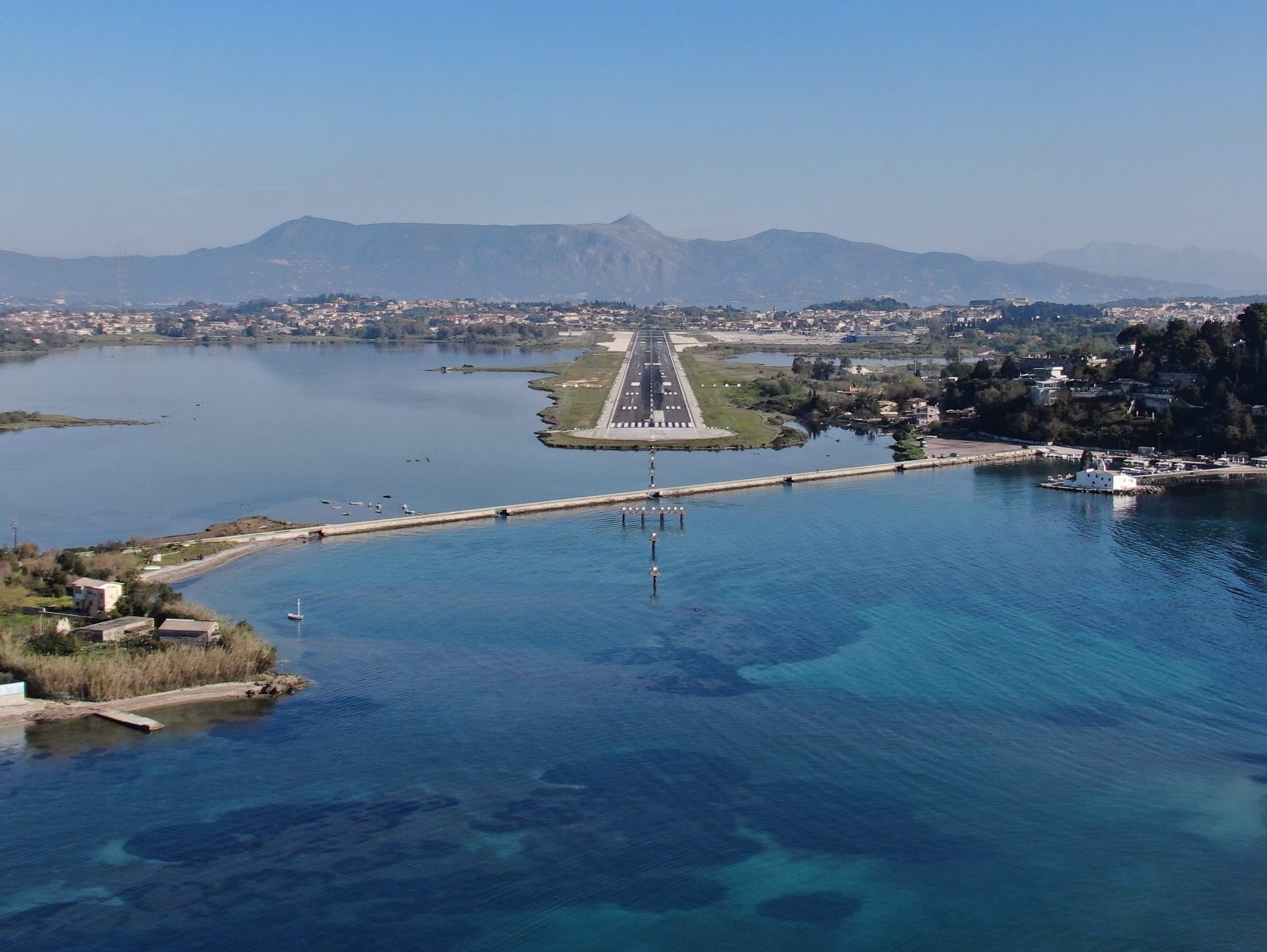 Aerial view of Corfu Airport runway and its coastal surroundings